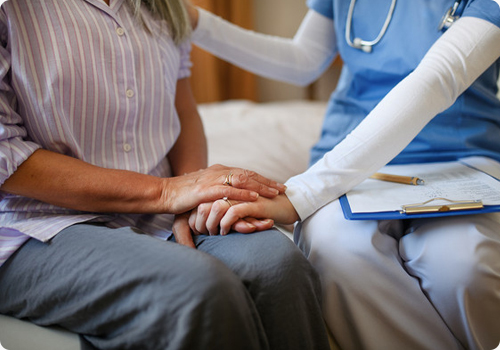 Hospice nurse explaining Medicare hospice coverage to the patient