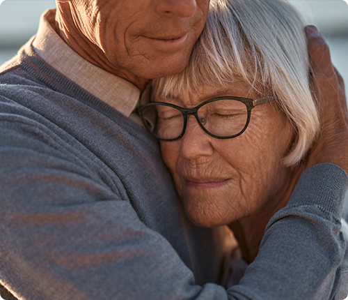 Nurse providing hospice support in skilled nursing facility room