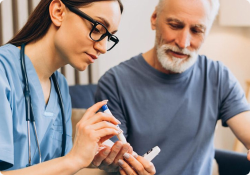 Palliative care nurse adjusting medication for patient comfort